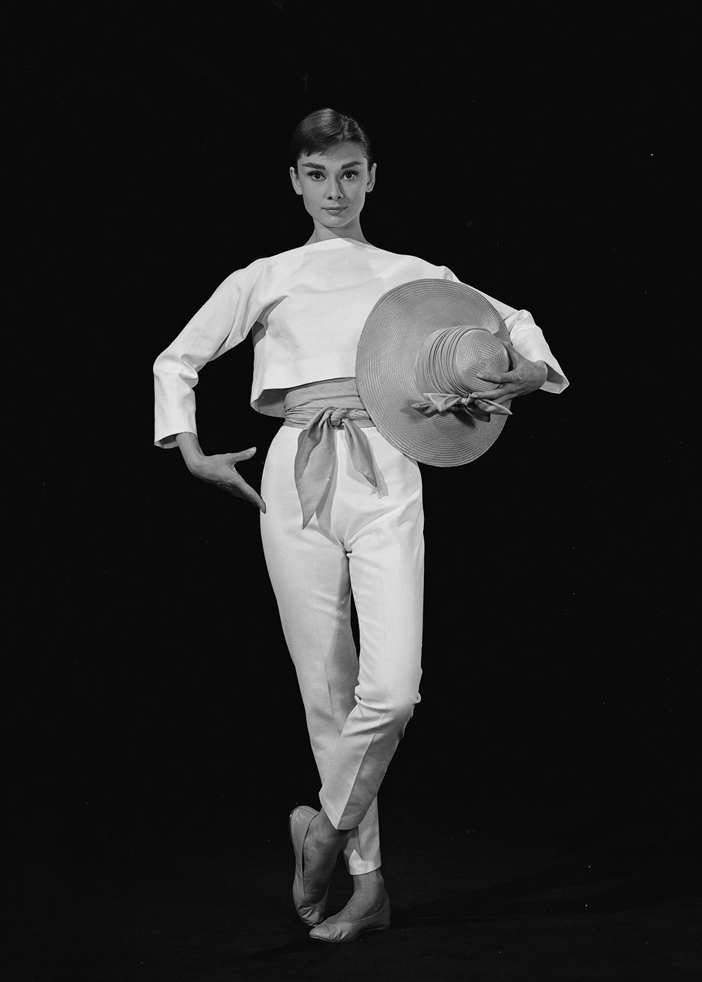 Audrey is costumed by Givenchy in Funny Face, 1957.