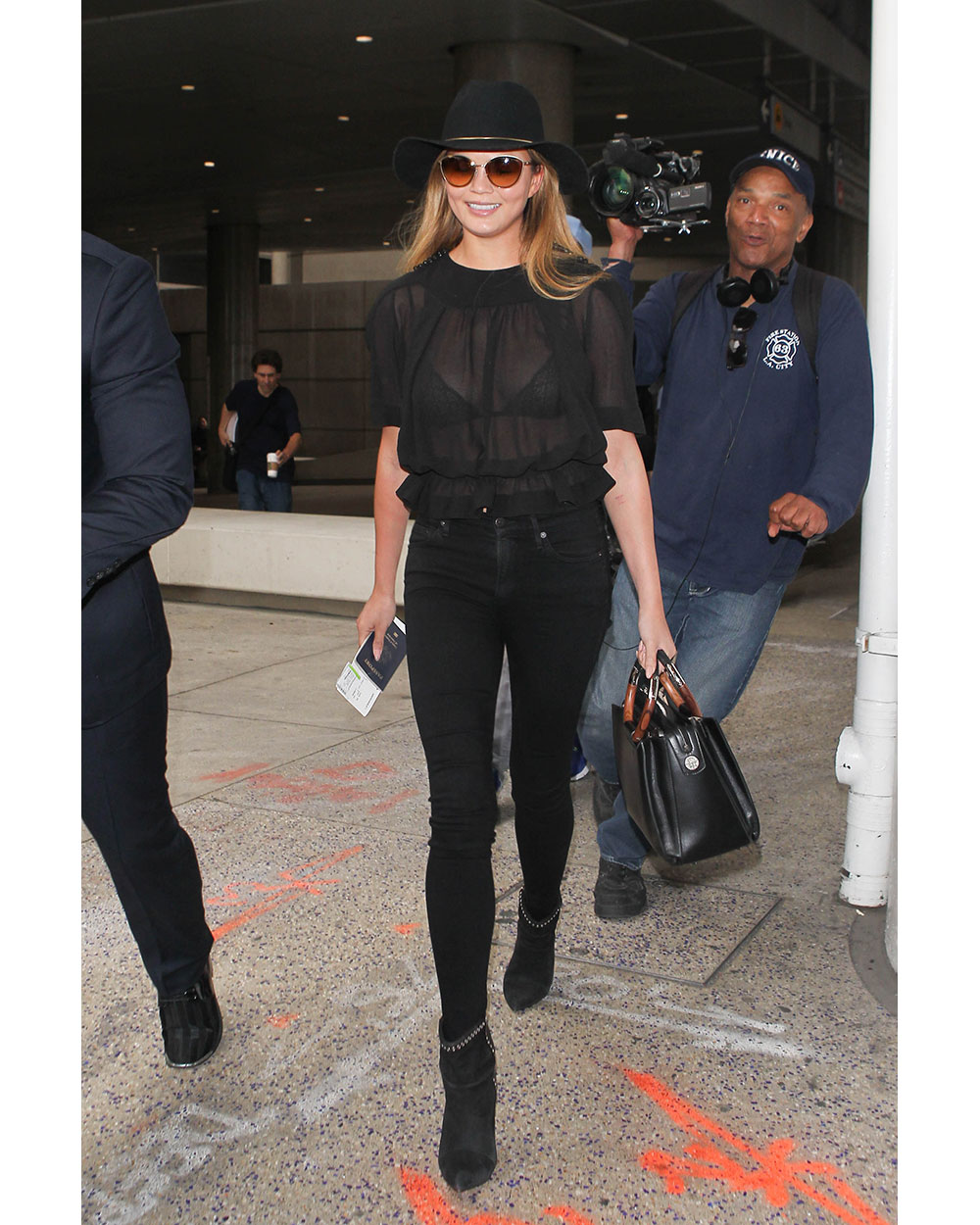 Chrissy Teigen wearing all black at LAX. Photo / Getty Images