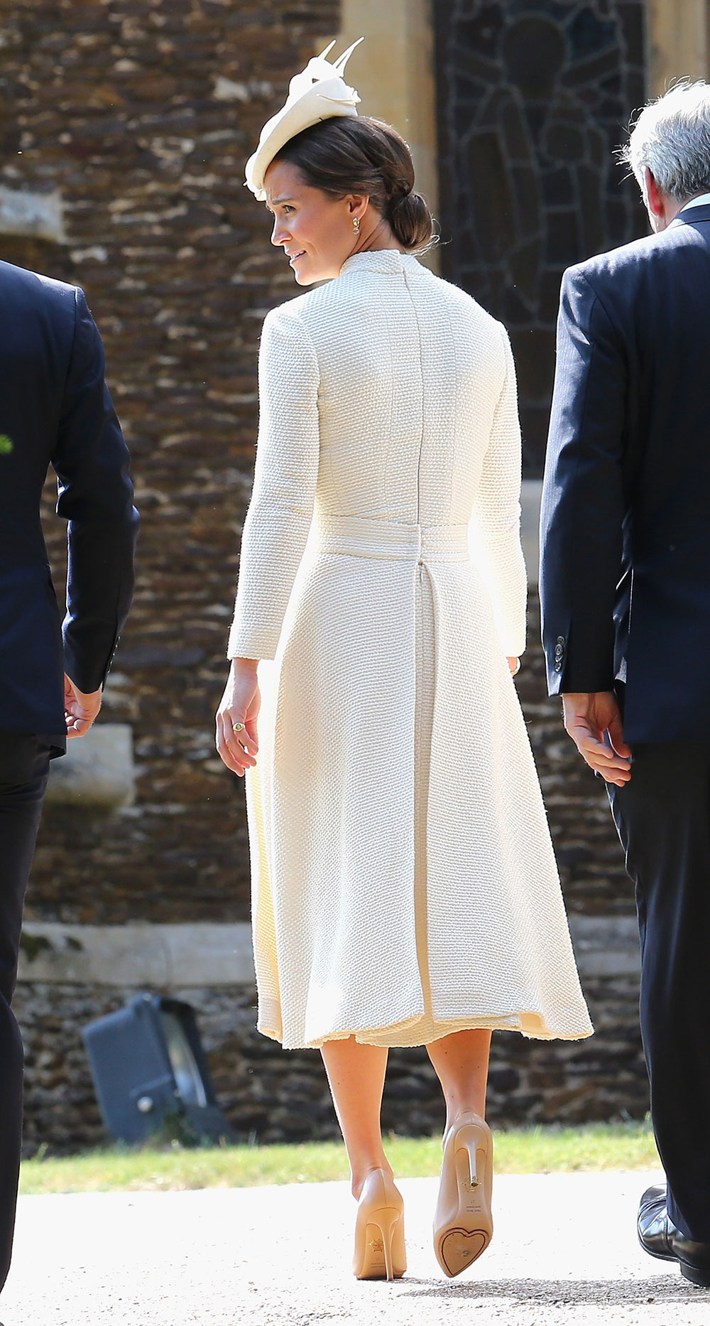 Pippa Middleton wears a white long-sleeved dress by Auckland-born designer Emilia Wickstead and Jane Taylor fascinator with nude leather pumps