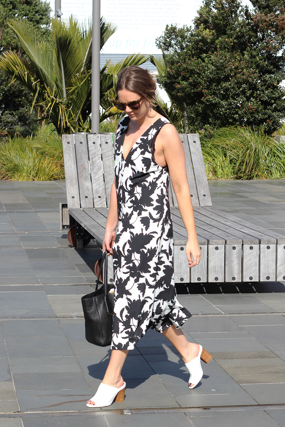 Lucy wears C/MEO Collective jumpsuit, Mi Piaci shoes, Marc by Marc Jacobs bag and Karen Walker sunglasses.