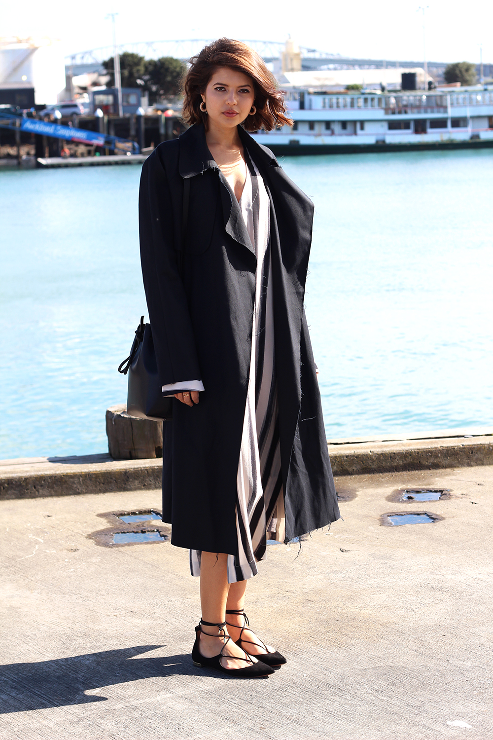 Talisa wears Bassike trench, Kate Sylvester trench, Mansur Gavriel bag, Aquazzurra shoes and Reliquia Jewellery earrings.