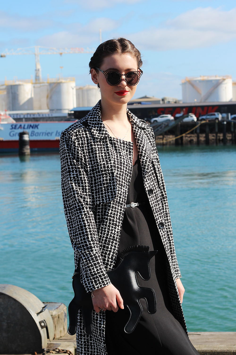 Ellen wears Farmers coat, Glassons dress, belt from Smith and Caughey’s, Choies bag and sunglasses.