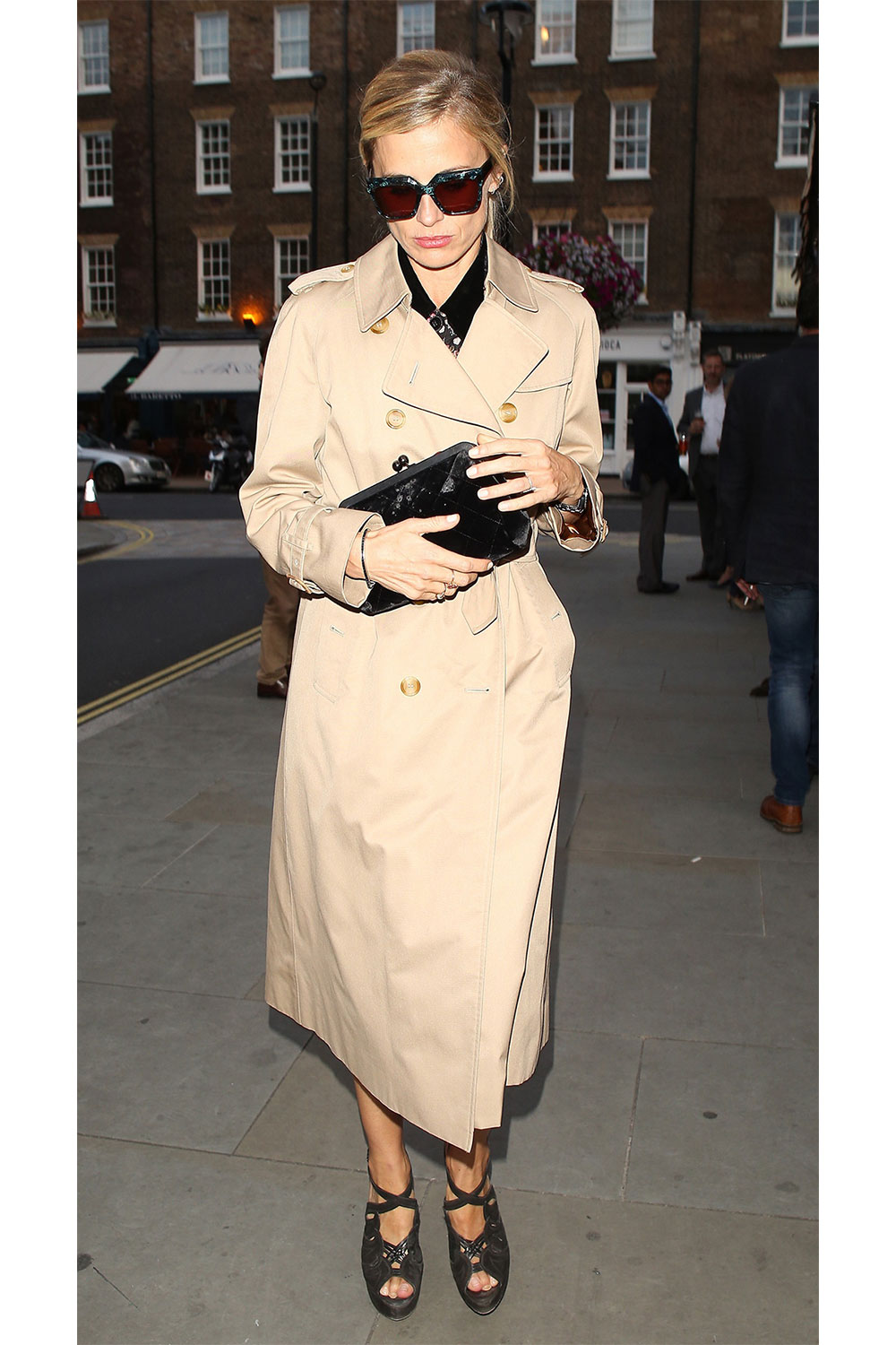 Model and fashion writer Laura Bailey looks chic in a long trenchcoat, while leaving London's Chiltern Firehouse. Photo / Getty Images