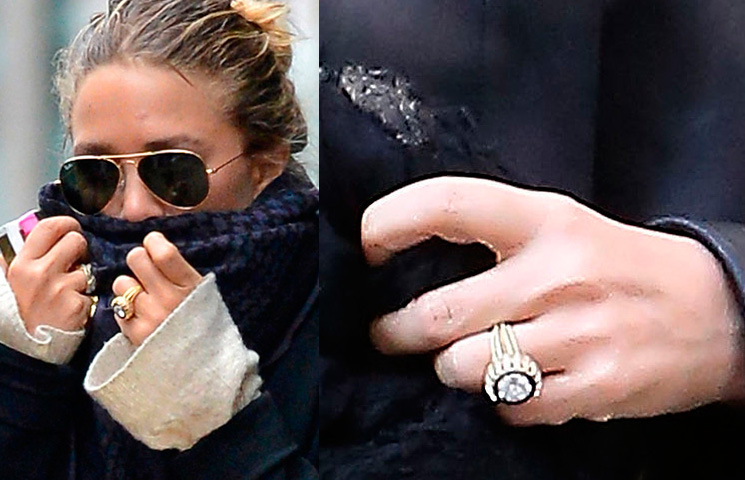 Mary-Kate Olsen's vintage Cartier engagement ring is certainly original and was bought at auction and presented to Mary-Kate by her now-husband Olivier Sarkozy. The ring, which dates back to 1953, consists of a central European cut 4 carat diamond surrounded by 16 sapphires. Photo / Getty Images