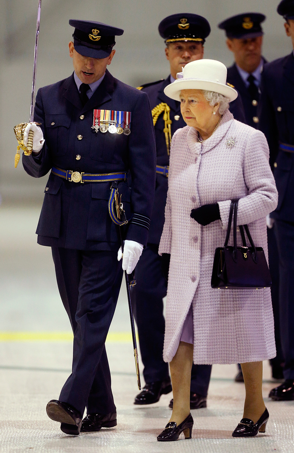 Lilac has always been one of the Queen's favourite colours to wear and she chose this lilac coat for a visit to RAF Lossiemouth in Scotland in 2014. Photo / Getty Images