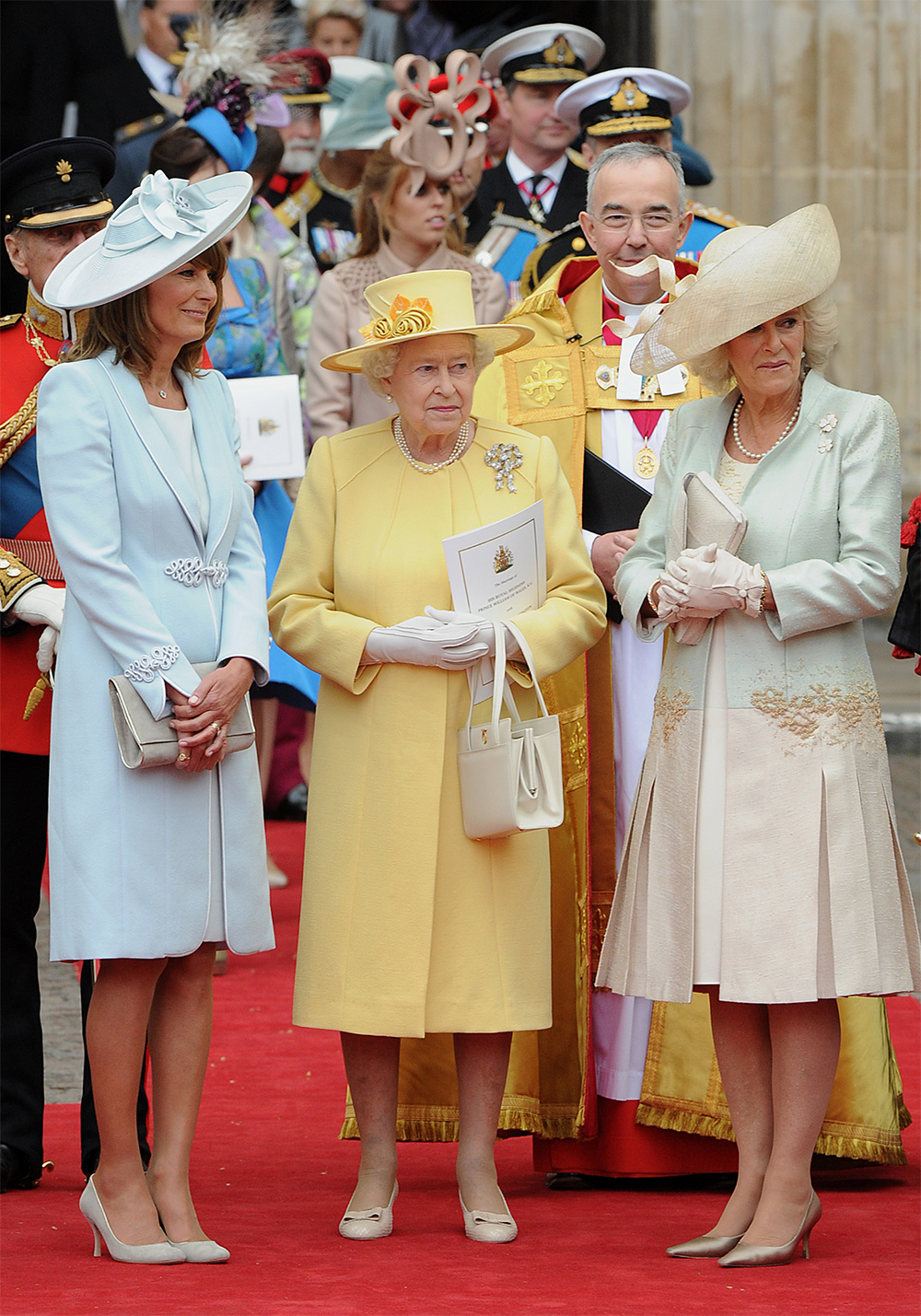 It may have been Prince William and Kate, the Duchess of Cambridge's day - but the Queen made sure her canary yellow coat suit would stand out in the crowd at the Royal Wedding in 2011. Pictured here with the mother of the bride, Carole Middleton, and Camilla, Duchess of Cornwall. Photo / Getty Images