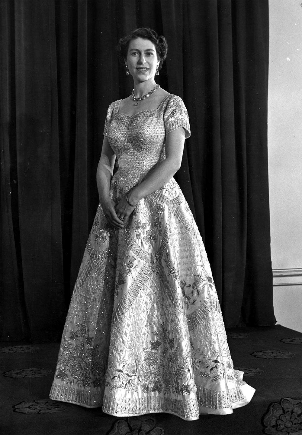 Queen Elizabeth II wearing a gown designed by Norman Hartnell for her Coronation ceremony on 2 June 1953. Photo / Getty Images