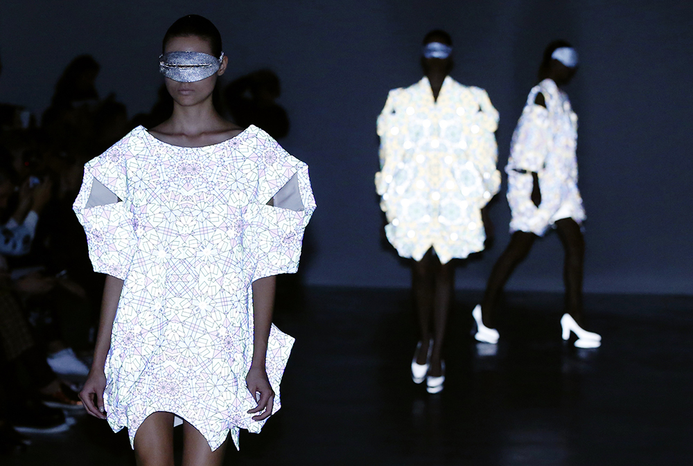 Anrealage used a photosensitive fabric that reflected camera flashes for a visually stunning display. Photo / Getty Images