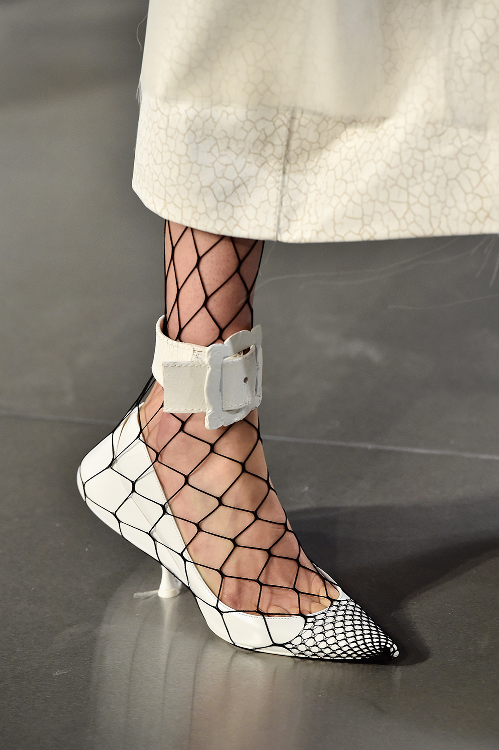 A new way of wearing your tights this spring? Fishnets were worn over shoes at Maison Margiela. Photo / Getty Images