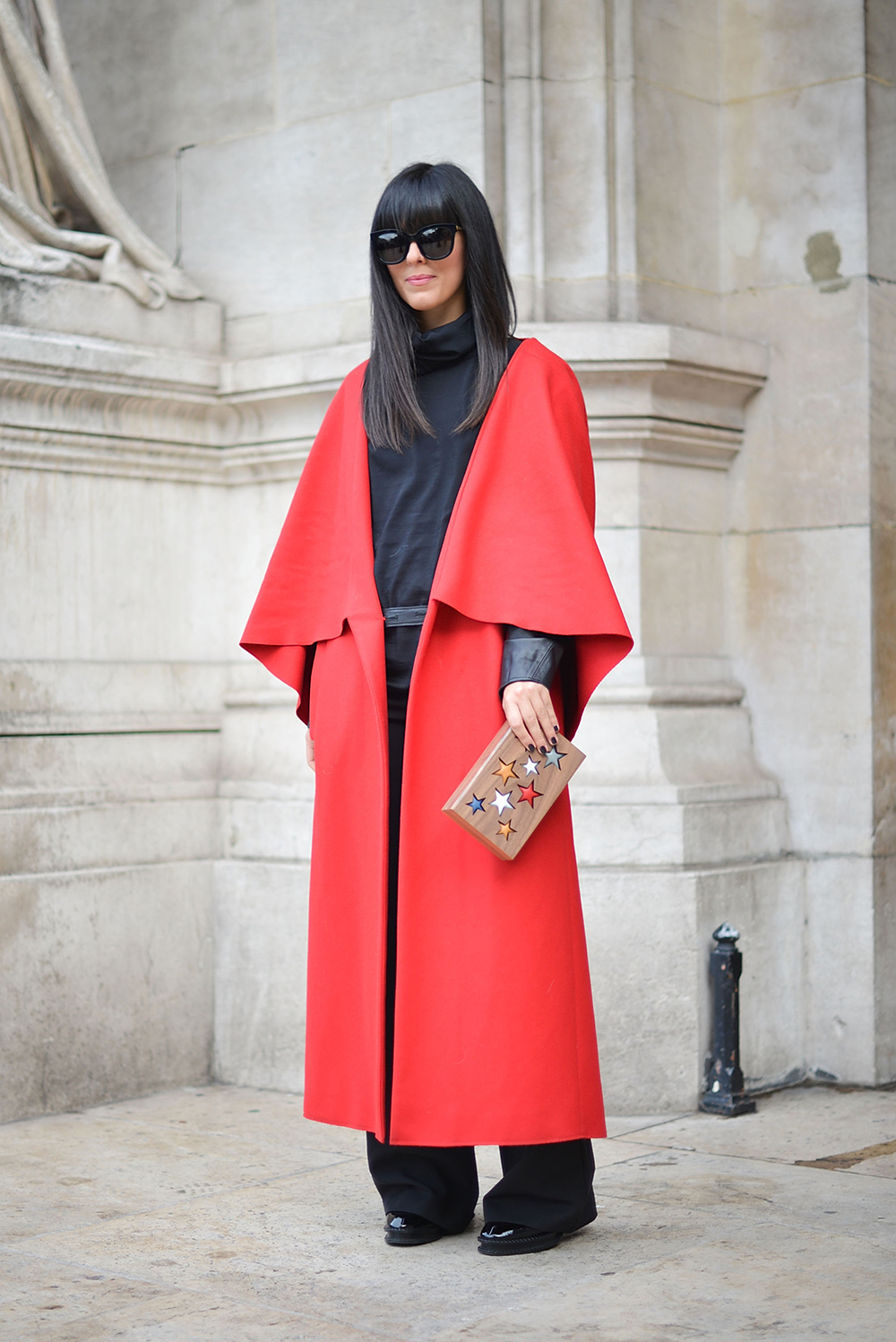 Laura Comolli poses wearing a Fatima Val coat and Lina Brax clutch before the Stella McCartney show. Photo / Getty Images