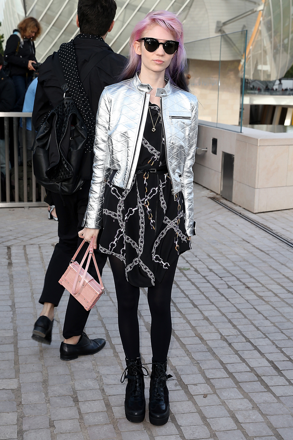 Singer Grimes arrives at the Louis Vuitton show.