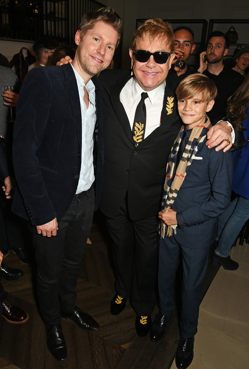 Christopher Bailey, Sir Elton John and Romeo Beckham at the Burberry festive film premiere