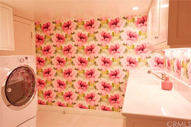 Pink floral wallpaper in the laundry might be more appealing to female buyers?!
