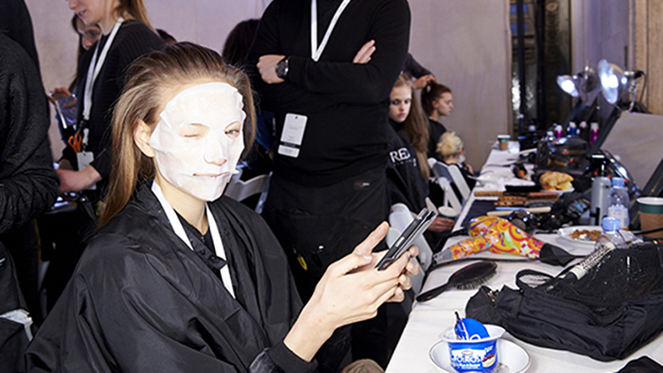 Models backstage with face masks at Victoria Beckham's show at New York Fashion Week