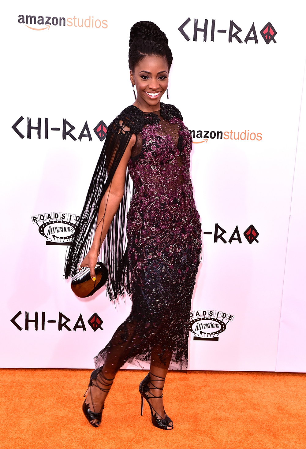 Teyonah Parris wearing Marchesa to the CHI-RAQ premiere in New York City.
