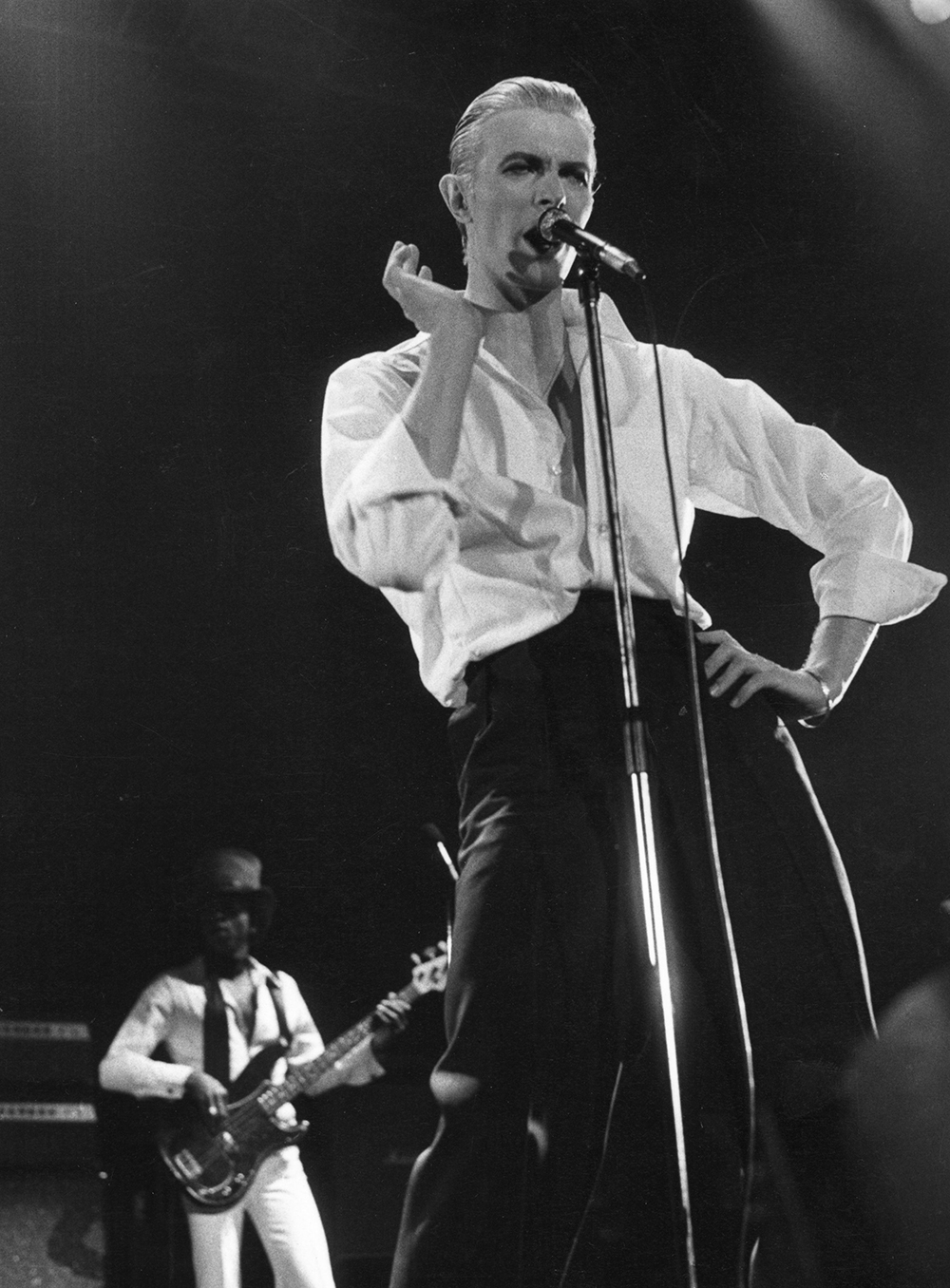 David Bowie performing live at Wembley stadium during his Station To Station tour in 1976.