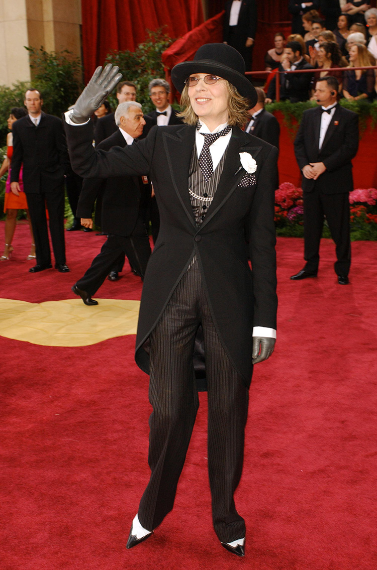 Diane Keaton accepting the Lifetime Achievement Award on behalf of Woody Allen wearing a tuxedo suit and two-tone shoes.