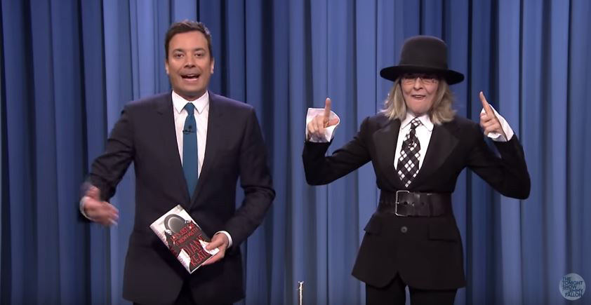 Diane Keaton playing beer pong with Jimmy Fallon (but substituting beer for her drink of choice: red wine on ice).