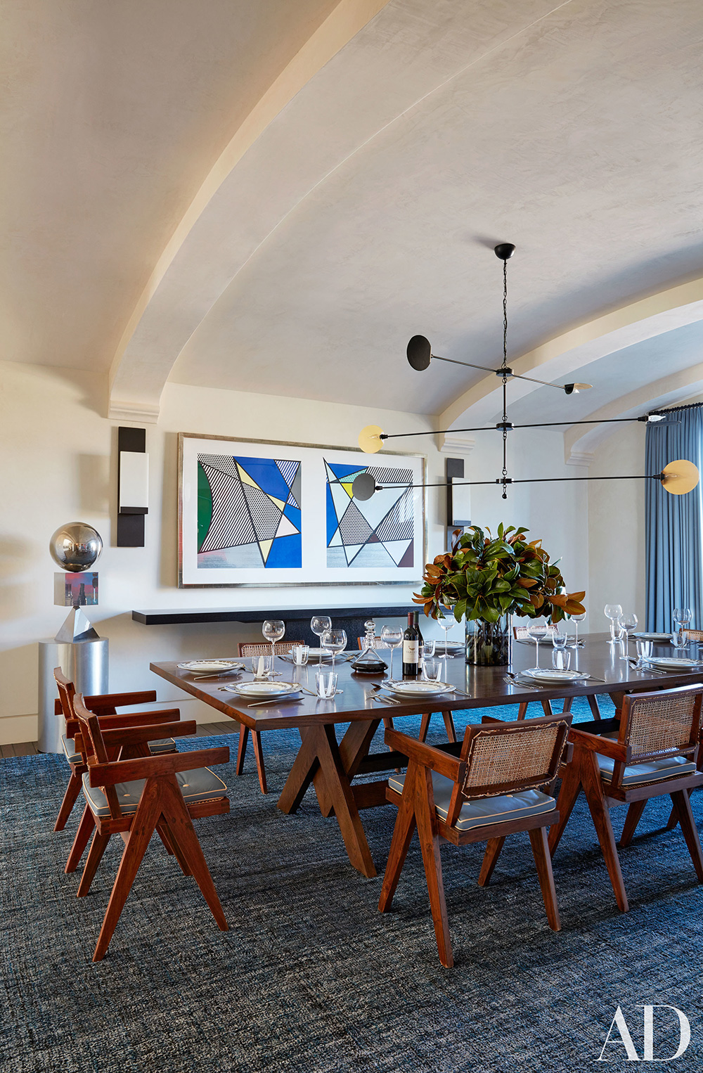 Kourtney's dining room features a large framed artwork by Roy Lichtenstein.