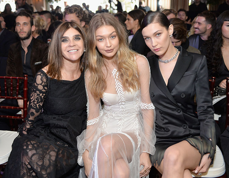 Honoree Carine Roitfeld and models-of-the-moment Gigi and Bella Hadid sit front row at the awards.