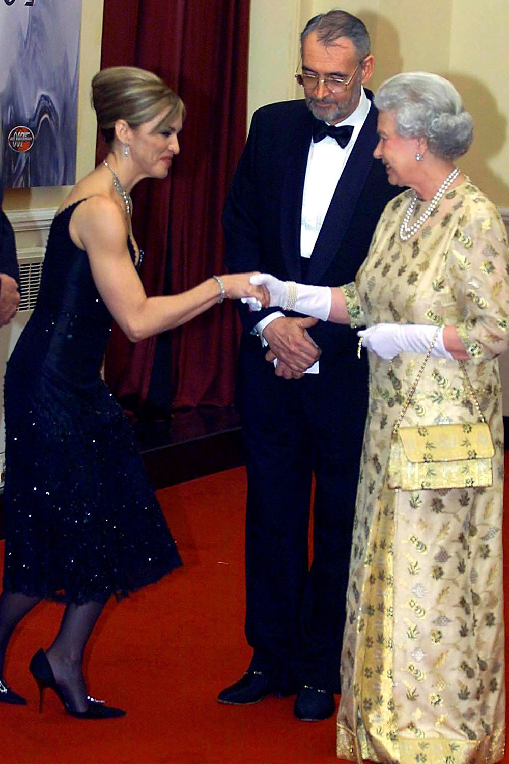 Madonna meeting Queen Elizabeth II at the world premiere of Die Another Day, 2002.