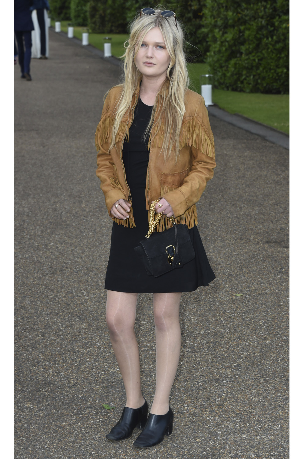 Sophie keeps thing casual at the Vogue and Ralph Lauren Wimbledon party in an on trend fringed suede jacket at The Orangery in 2015.