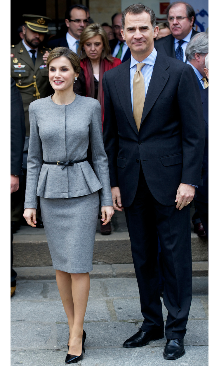 Queen Letizia of Spain looks elegant in a grey skirt suit at an event with her husband King Felipe VI.