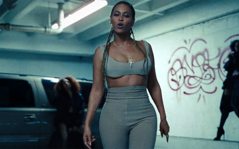 Beyonce wears Yeezy crop top and leggings and necklace by Lynn Bann