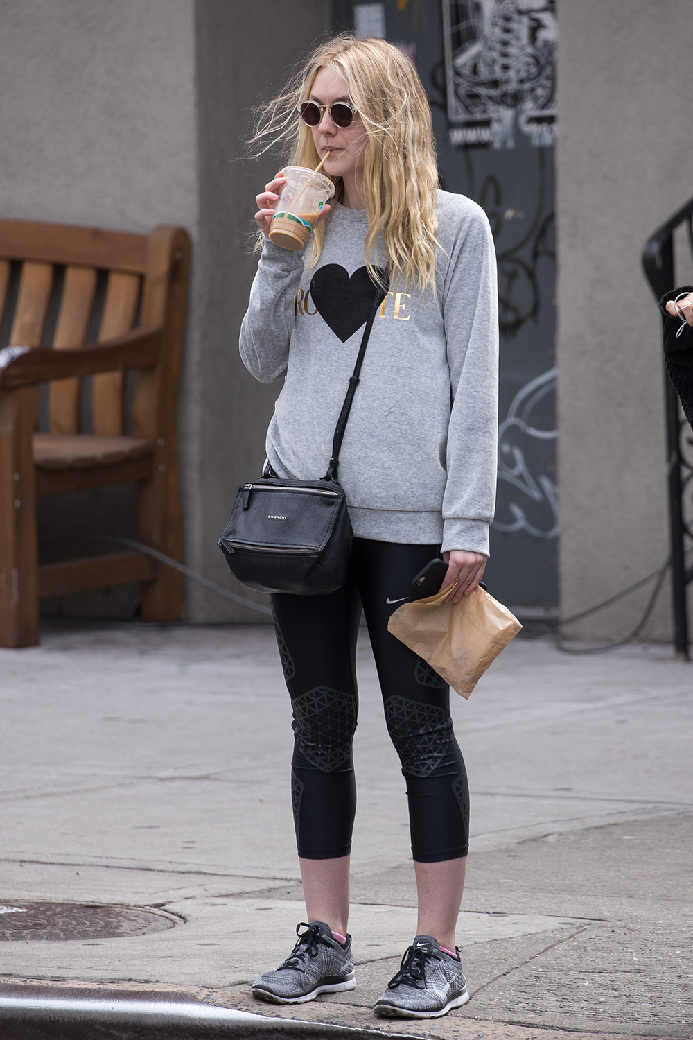 Dakota Fanning keeps things cool in a grey Rodarte sweater while out and about in New York.