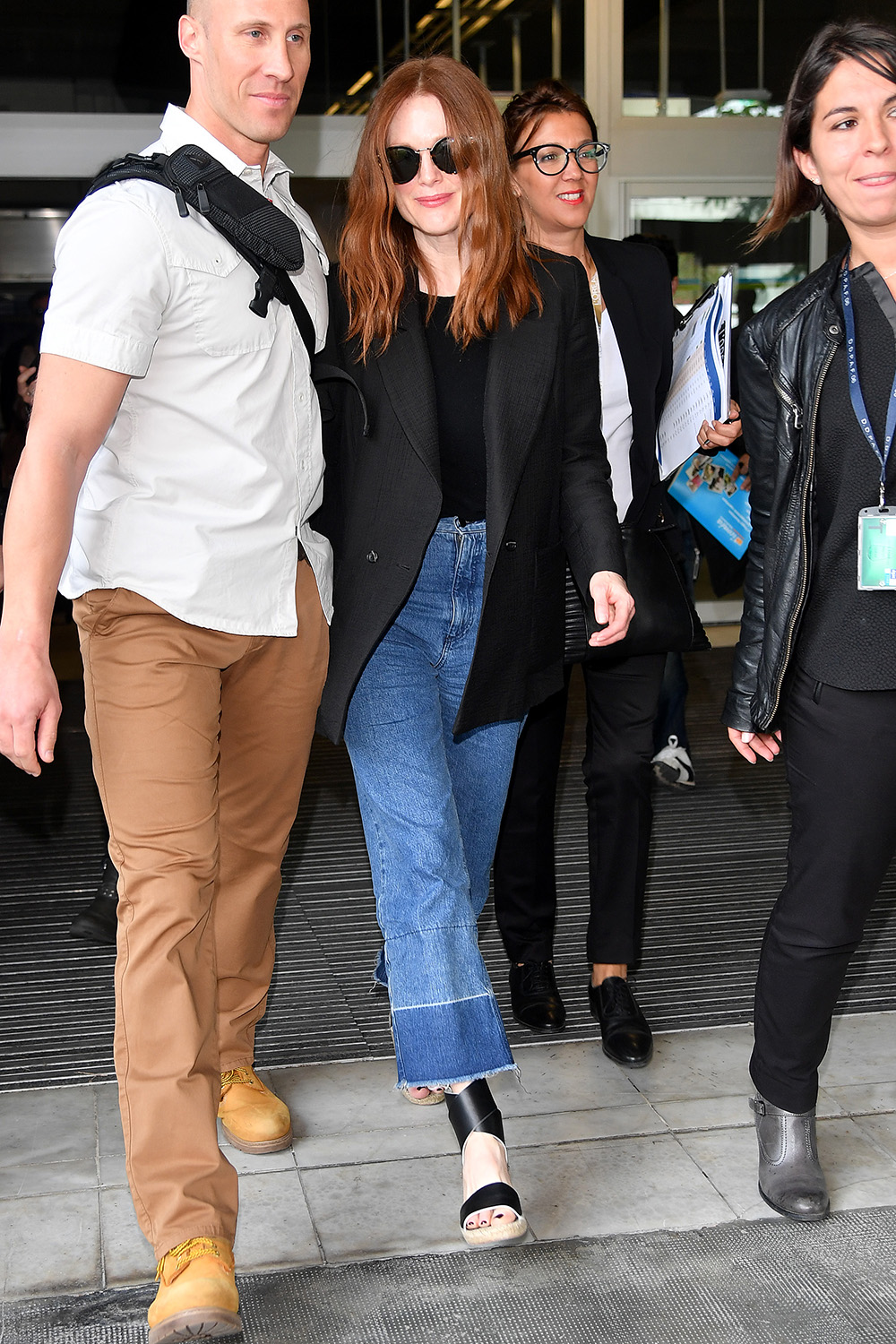 Julianne Moore shows off her classic style in a black blazer and pair of on trend frayed denim jeans in France.