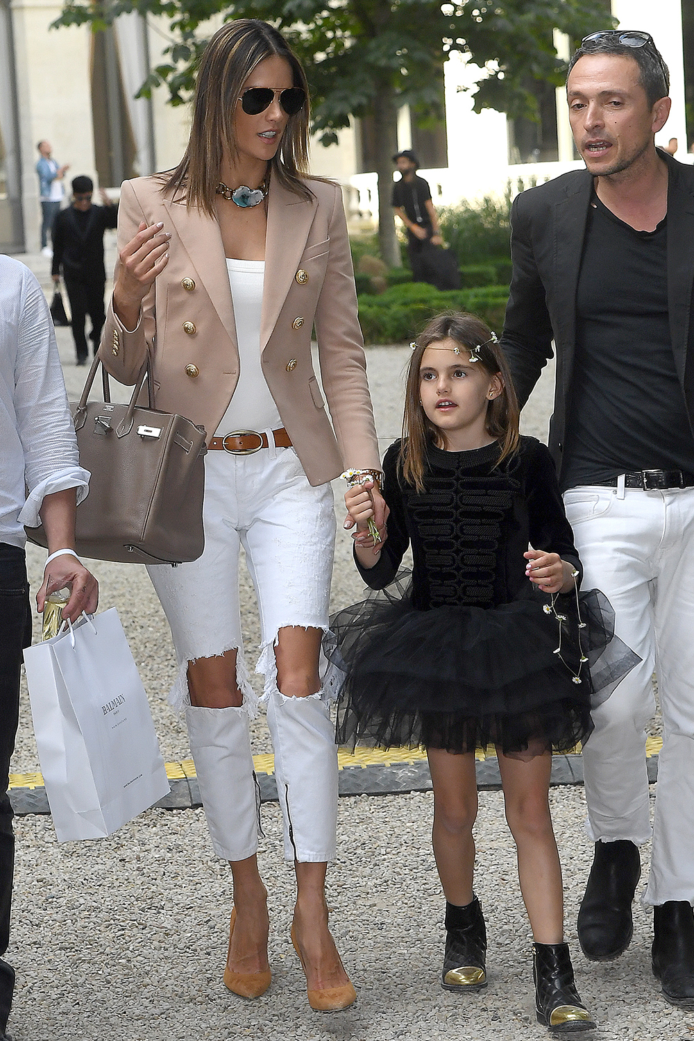 Alessandra Ambrosio and her daughter Anja Mazur leaving the Balmain Show during Mens Paris Fashion Week.