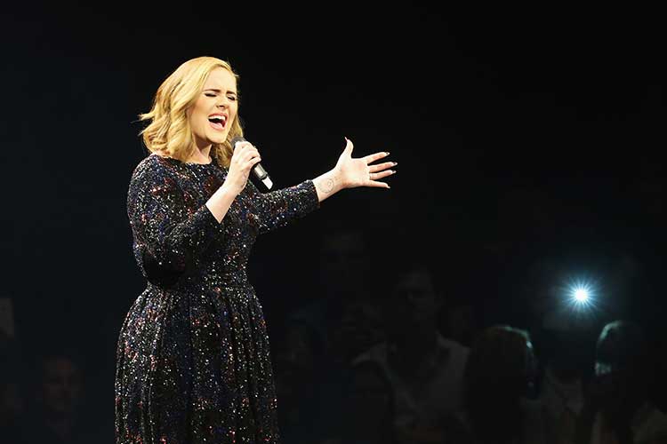 Adele performing on stage 