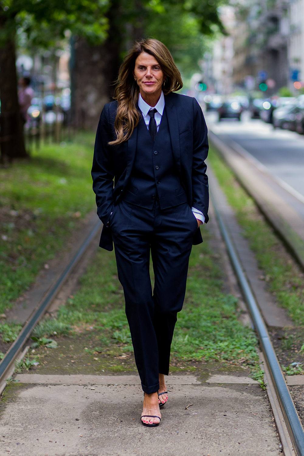 Anna Dello Russo does menswear like no one else in a three-piece Dolce & Gabbana suit during Milan Men's Fashion Week Spring/Summer 2017.