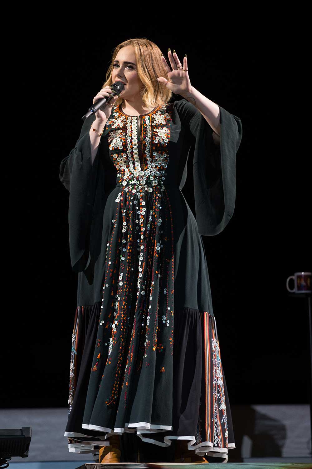 Adele, in a custom Chloe dress that took over 200 hours to make, performs at Glastonbury.
