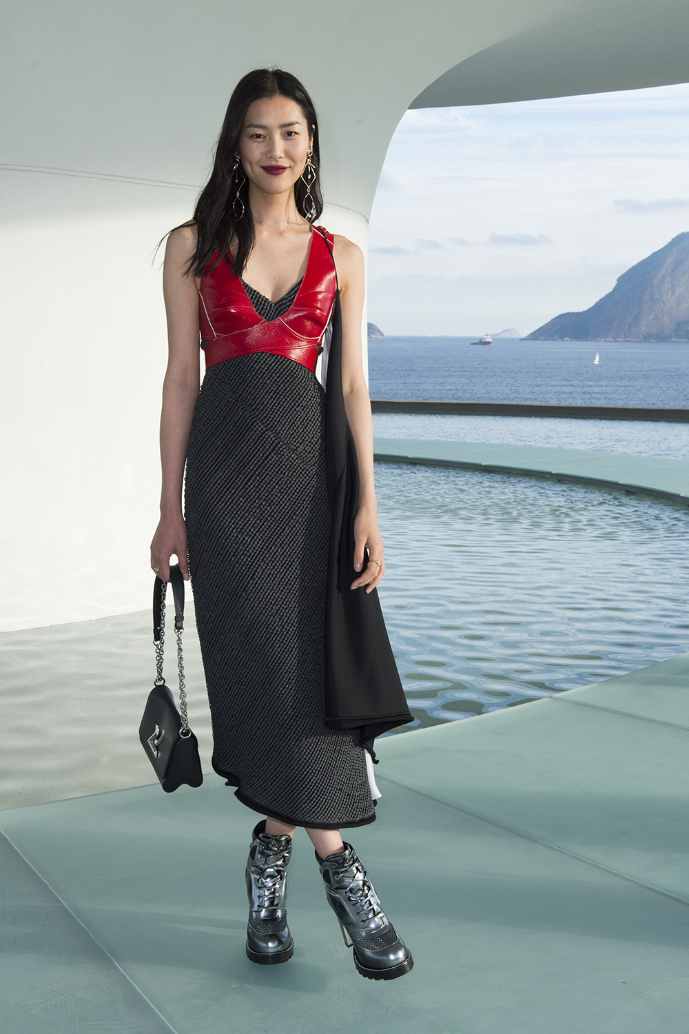 Liu Wen keeps things cool in a red Louis Vuitton crop top and dress at the French fashion house's 2017 Cruise collection in Rio.
