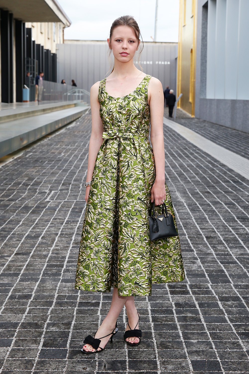 Mia Goth brings the glamour to Milan in a ladylike green dress at a private dinner hosted by Miuccia Prada and Patrizio Bertelli during Milan Men's Fashion Week.