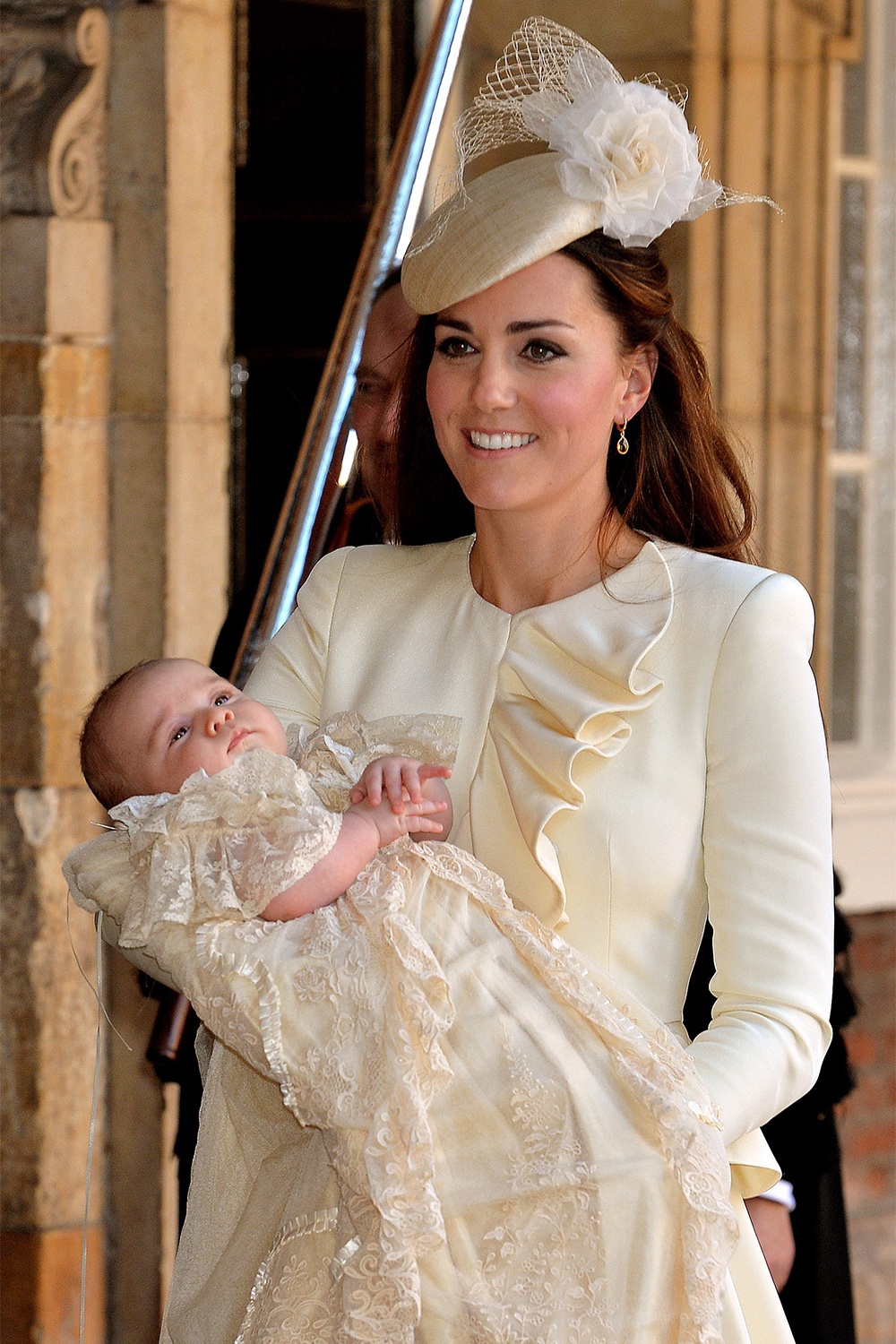 Prince George with his mother Catherine, in Alexander McQueen after his christening at the Chapel Royal in St James's Palace on October 23, 2013 in London.