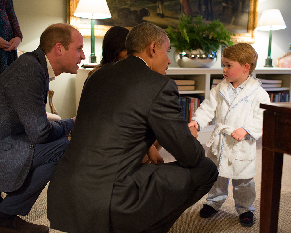 Prince George staying up after his bedtime to chat to President Obama in his gorgeous monogrammed robe and checked PJ's at Kensington Palace on April 22, 2016.