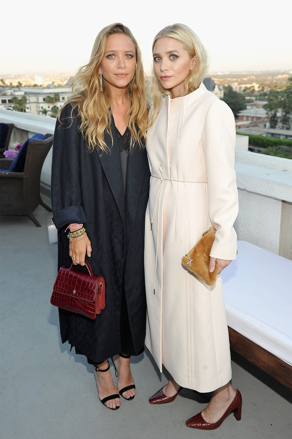 Designer-duo Mary-Kate and Ashley Olsen look impeccable in their signature minimalist style at the launch of their Elizabeth and James flagship store opening party at the Chateau Marmont in LA.