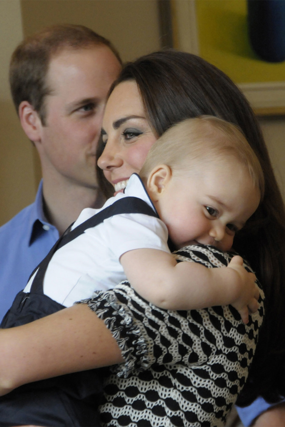 Our hearts melted when the little Prince cuddled up to his mother at a Plunkett Parent's Group at Government House on April 9, 2014 in Wellington during the royal tour.