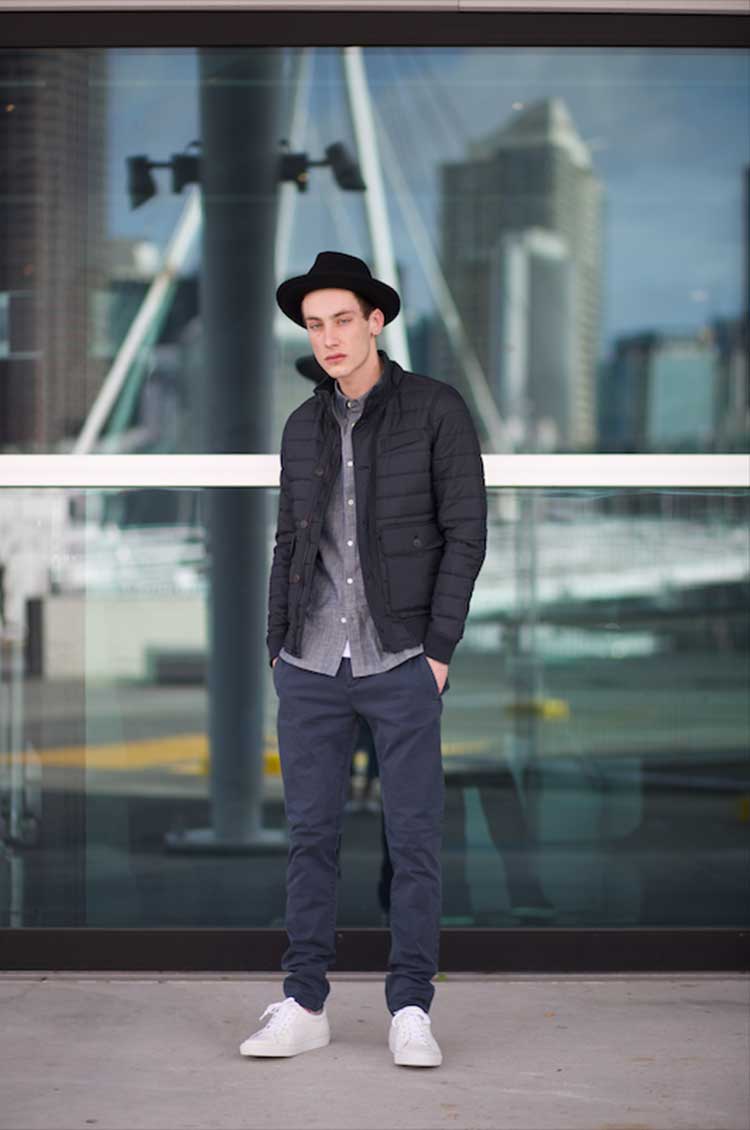 DAY 6: He wears: Slim fit strtech chino pant, Classic V Neck tee, Chambray shirt, Oversized Porkpie hat, Quilted Jacket and classic leather sneaker all from French Connection.