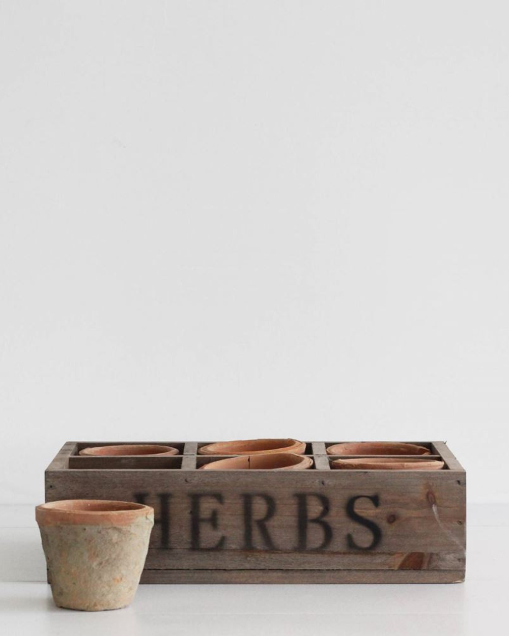 Antique resdtone herb pots, $72, from Father Rabbit.
