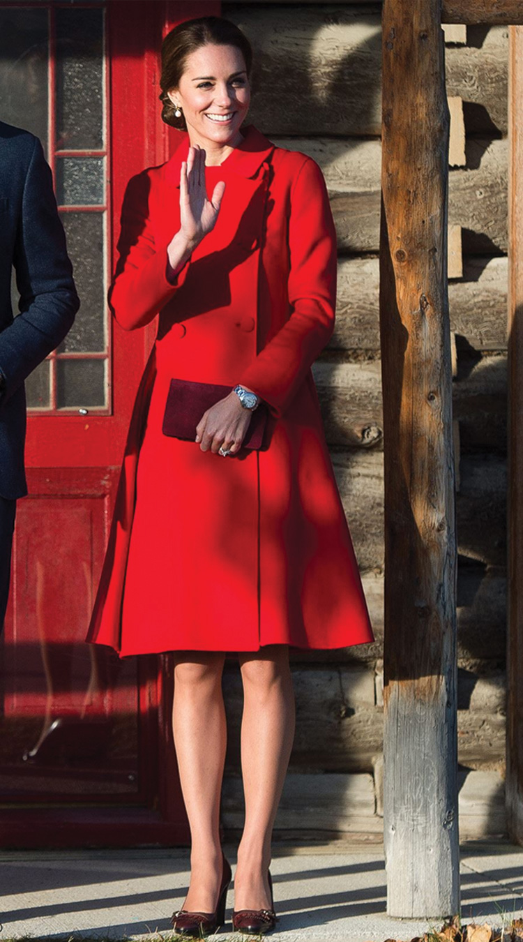 A demure scarlet Carolina Hererra coat for the fifth day of the tour
