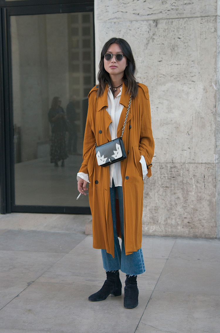 Kim Tran wears a Zara coat, Rose Anna bag, Levis Vintage jeans and Carritz shoes on day 2 of Paris Womens Fashion Week SpringSummer 2017, on September 28, 2016