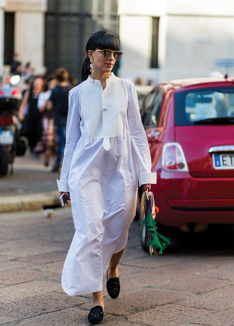Laura Comolli wearing a white dress outside Ferragamo during Milan Fashion Week SpringSummer 2017 on September 25, 2016