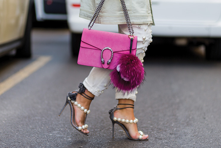 Nina Schwichtenberg wearing pink Gucci bag, pants and heels with pearls outside Dolce & Gabbana during Milan Fashion Week SpringSummer 2017 on September 25, 2016