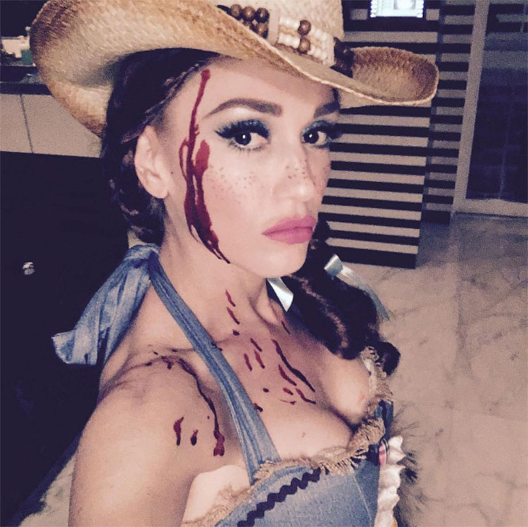 @GwenStefani dressed up as a bloodied cowgirl.