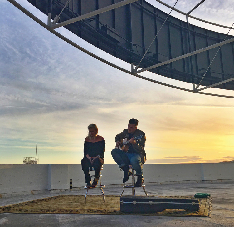 Georgia and Caleb Nott of Broods perform on the roof of the Capitol Records Building in LA.