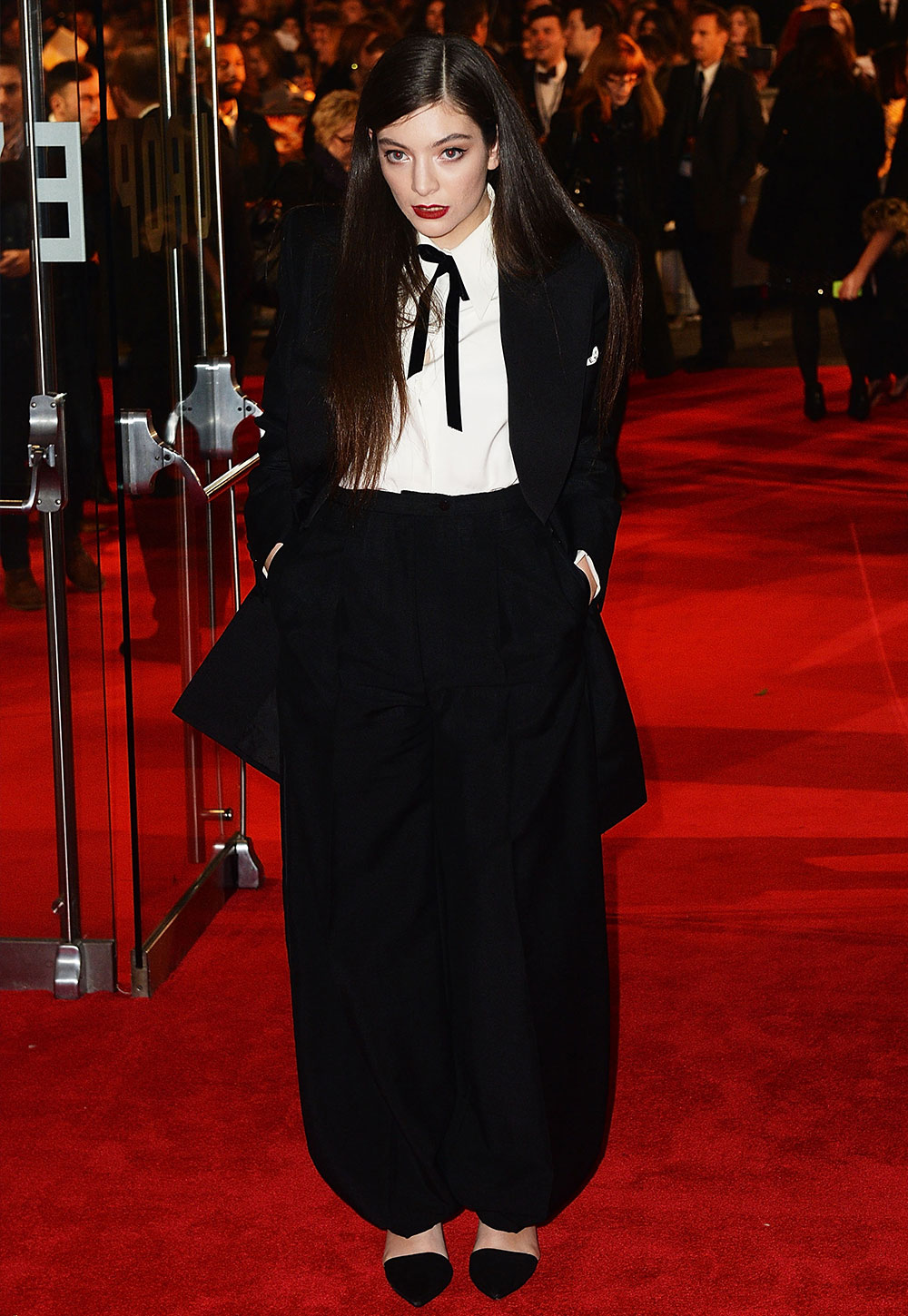 Lorde attended the World Premiere of The Hunger Games Mockingjay Part 1 on November 10, 2014 in London. Her song, Yellow Flicker Beat, was the soundtrack's lead single. The then 18-year-old wore an oversized tuxedo from Schiaparelli's Spring 2014 Couture collection.
