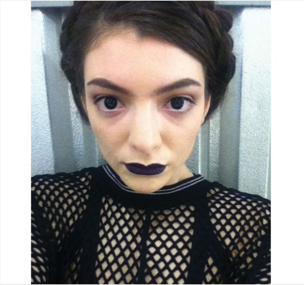 In her iconic video for Tennis Court, Lorde rocked dark makeup and black contact lenses, posting this photo on Instagram with the caption: 